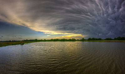 Peacock storm reflection in Lawrence, Kan., by davedehetre on Flickr